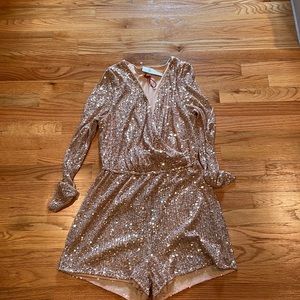 Super fun rose gold sequin romper. Perfect for an eras outfit or bach party!